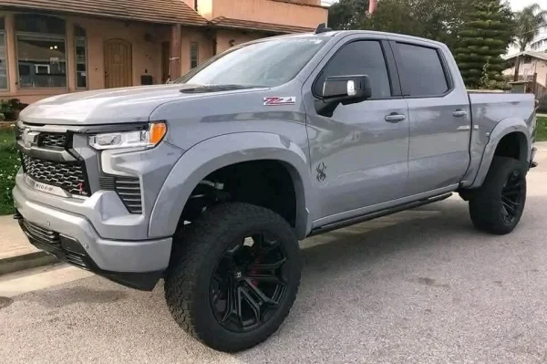 2005 Chevy Silverado Z71 for sale with 6-inch Fabtech lift, XD Series 20-inch wheels, and 35-inch tires at Stricker Cars Yard