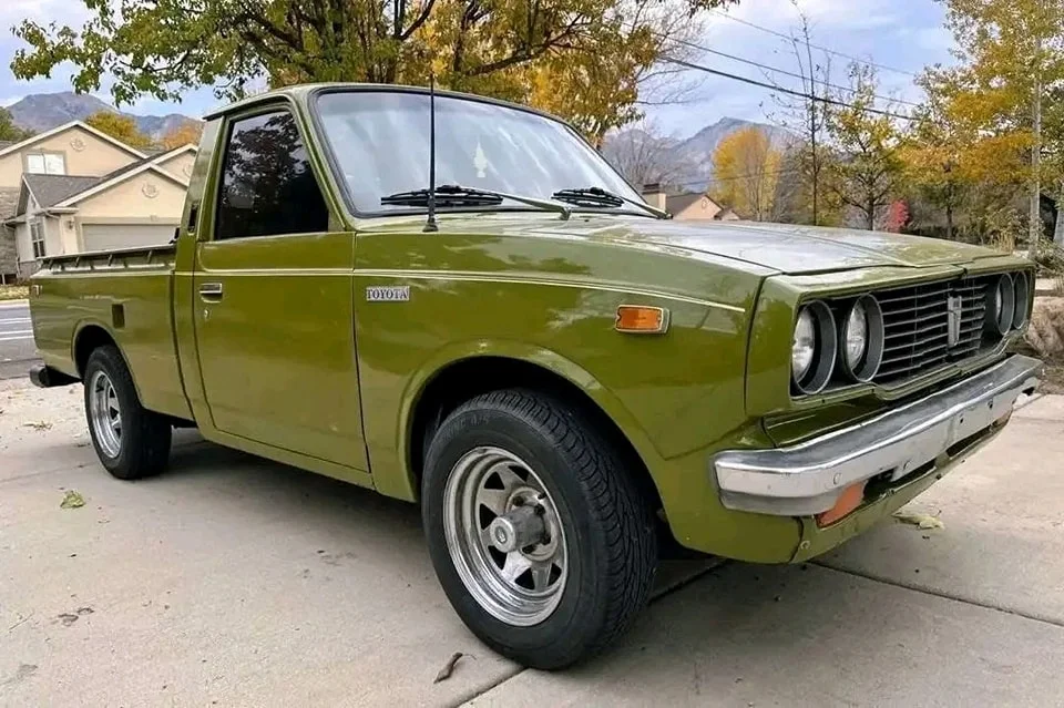 1975 Toyota Pickup SR-5 in green with white pinstriping, 65K miles shown, five-speed manual, for sale at Stricker Cars Yard